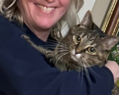 photo of Anne holding the family cat.