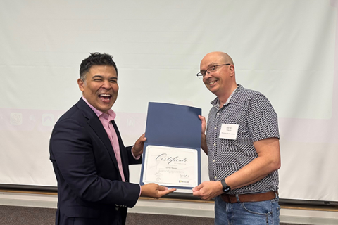 Completion certificate for LLNJ’s PM Fundamentals + AI Integration Bootcamp, presented by Sam Sena (left) to Darren Miguez, Plainsboro Public Library