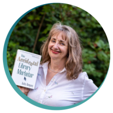 Kathy Dempsey holds her book, The Accidental Library Marketer